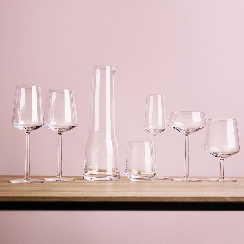 empty iittala essence glassware collection on wooden table