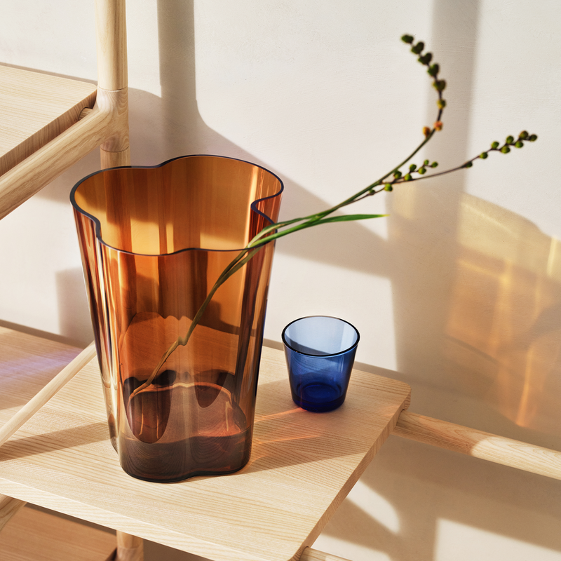 iittala Kartio Ultramarine tumbler next to large copper vase