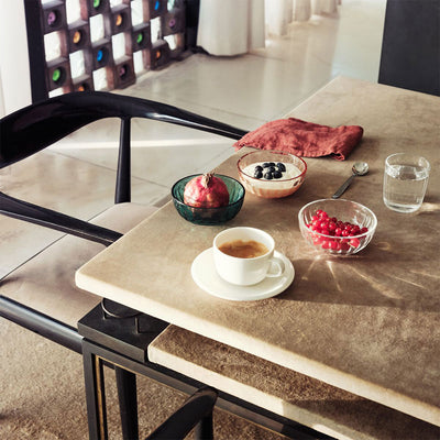 three raami glass bowls on table with coffee and water cups