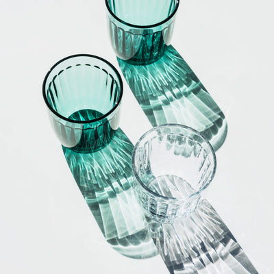 three Raami tumblers with reflections on table
