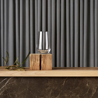 iittala Essence Universal Glass sitting on wood block for presentation