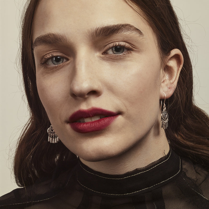 person with brown hair and red lipstick wearing Kalevala Moon Goddess Silver Earrings