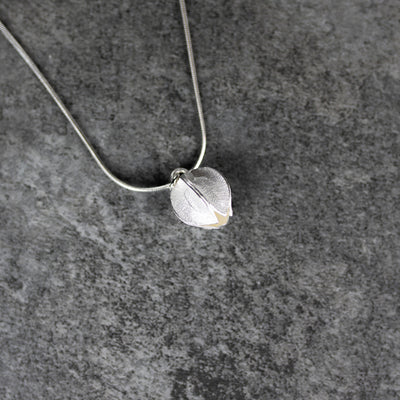 Kalevala Snow Flower Silver Necklace textured surface