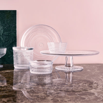 Kastehelmi clear glassware on marble tabletop with pink accent wall