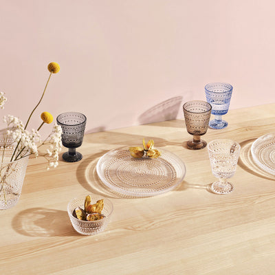 Kastehelmi tumblers, plate and dessert bowl on wood table