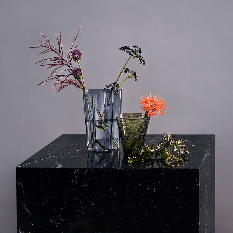 iittala Kastehelmi Dewdrop Moss Green Vase and Aalto rain vase on marble display&