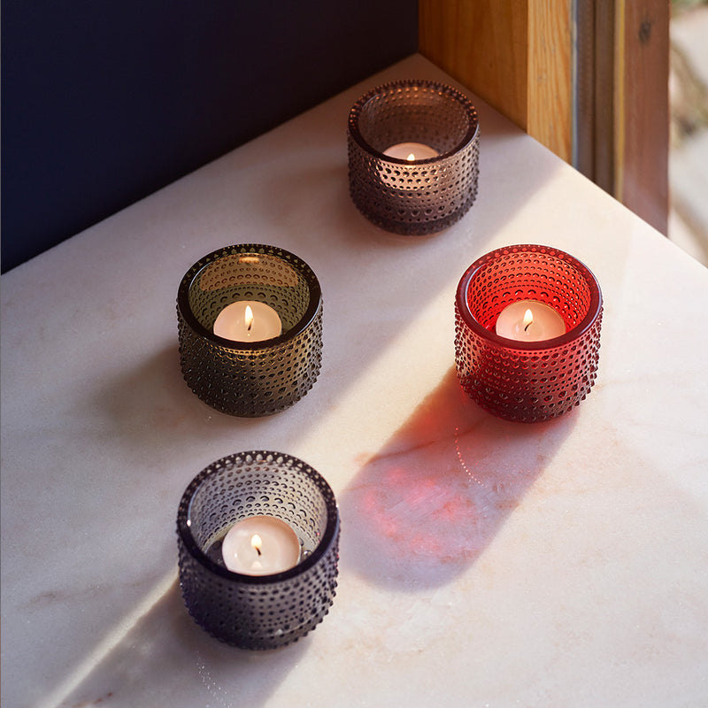 4 iittala Kastehelmi Dewdrop Votives holding lit tealights