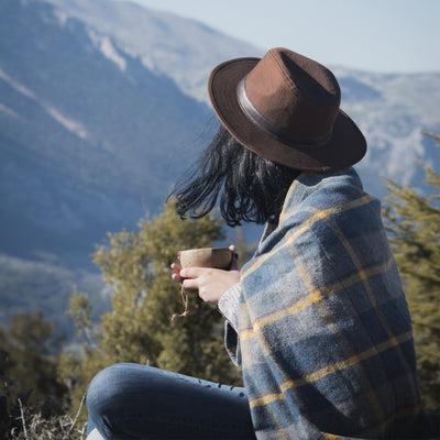 Women looking towards mountains while holding Kupilka cup