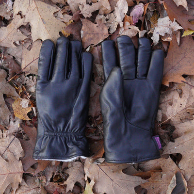 Käsinetori Men's Leather Gloves w/ Wool Lining laying on floor of leaves