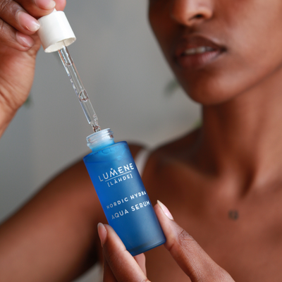 Person applying Nordic Hydra Aqua Serum