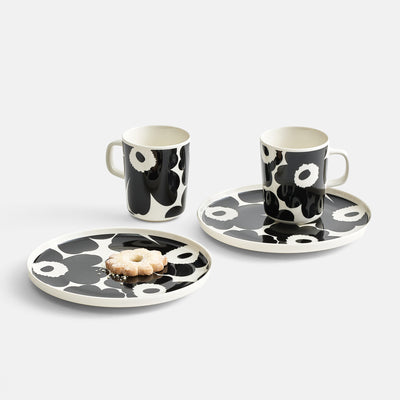 Display grouping of Marimekko Unikko porcelain dinnerware in white/black