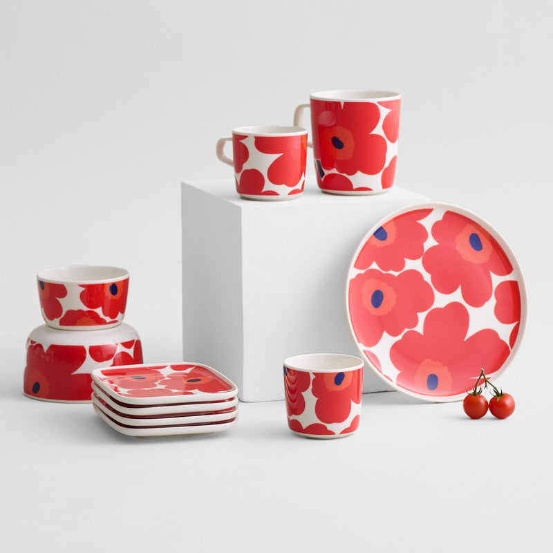 Display grouping of Marimekko Unikko dinnerware collection in white/red