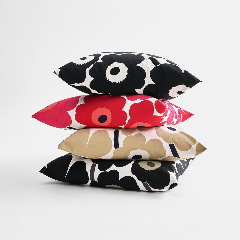 Colored Marimekko Unikko Cushion Covers stacked on eachother