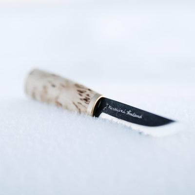 Marttiini Arctic Carving Knife laying in snow