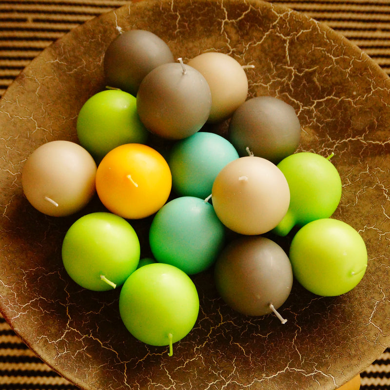 Finnish Bowl full of assorted color Footed Ball Candles 