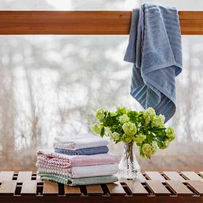 Finlayson Reilu towels on bench next to open window