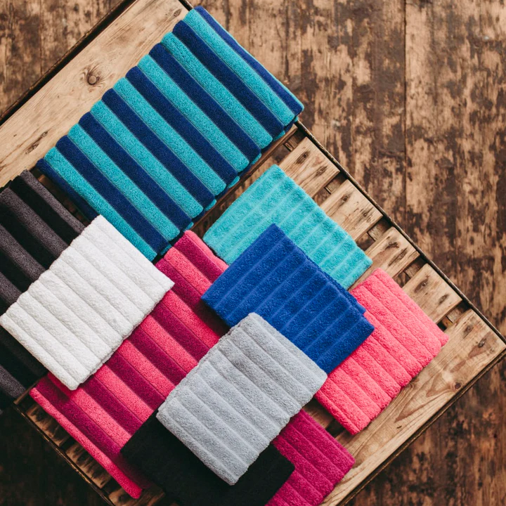 Assorted Finlayson Reiluraita towels on wooden pallet