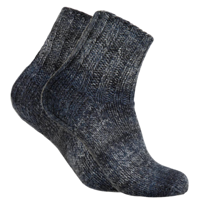 Pair of knitted socks made from Novita 7 Brothers Lapintaika Wool Yarn, mystique