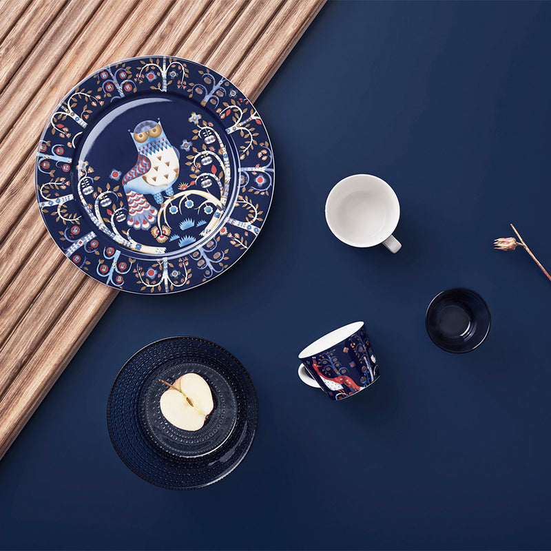 grouping of iittala taika blue dinnerware