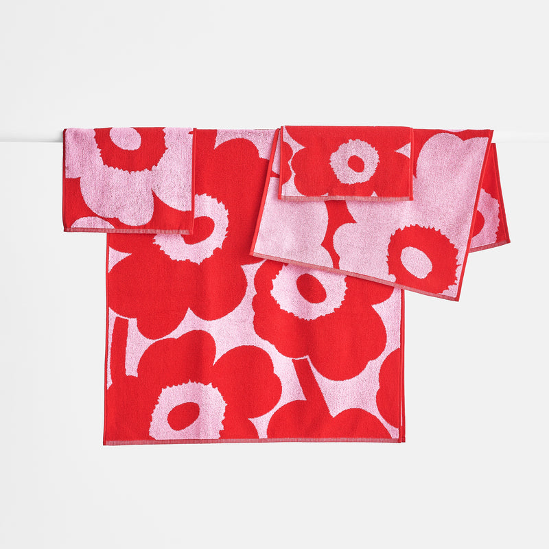 Display grouping of Marimekko pink/red Unikko Bath Towels